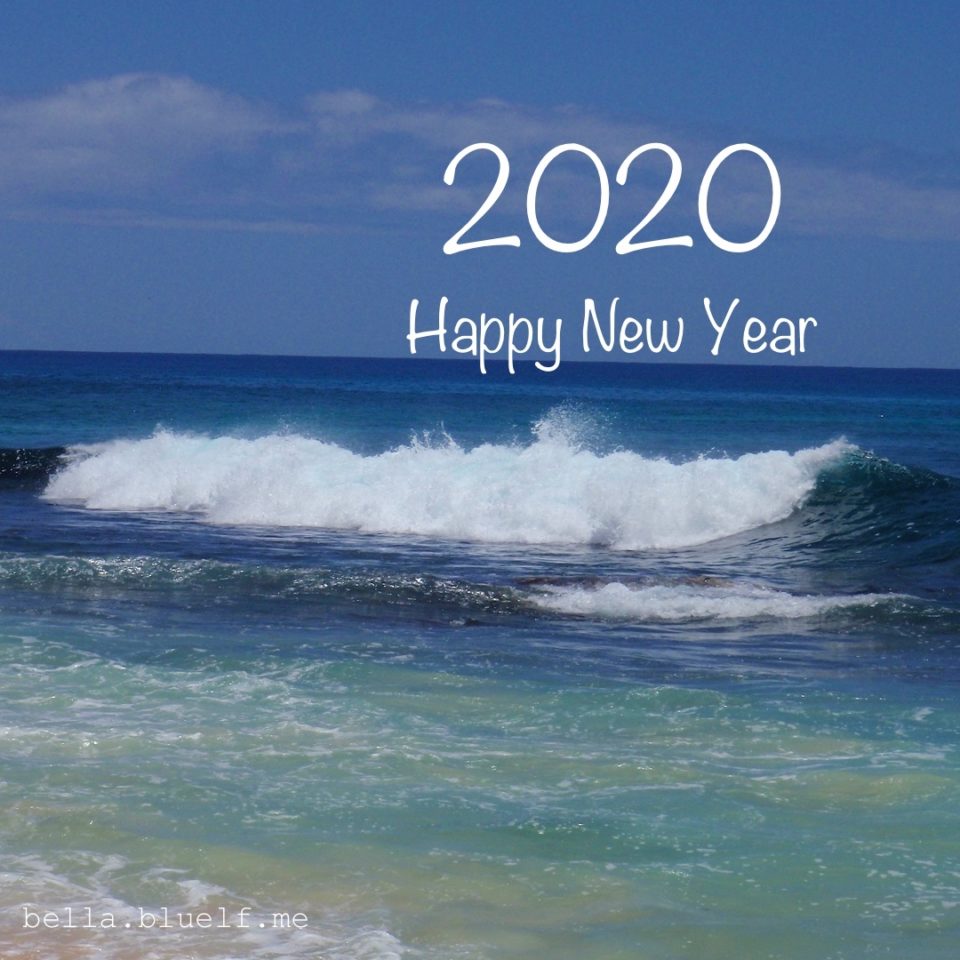 ocean wave braking with message for happy new year 2020